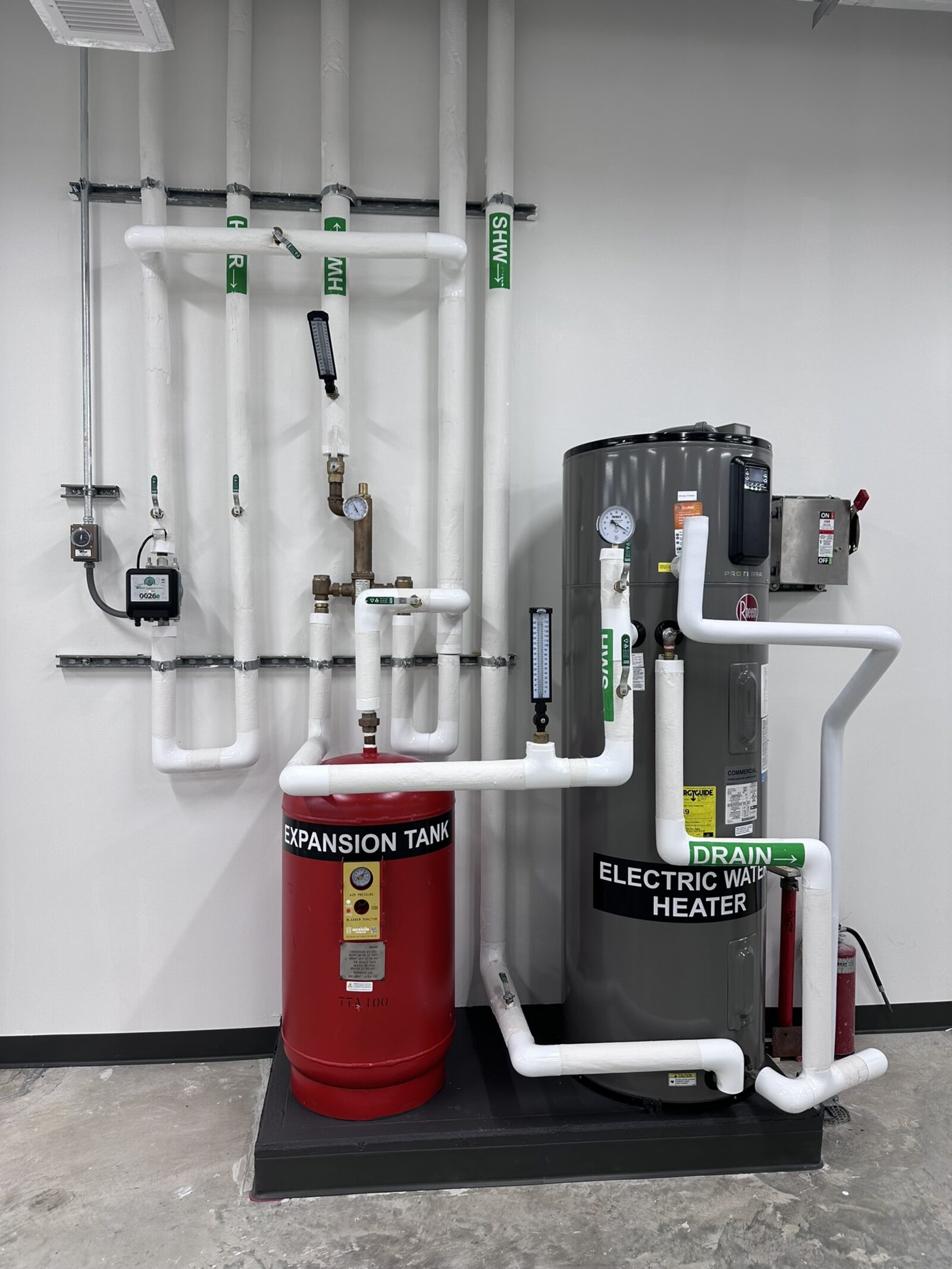 Mechanical room with heat-pump water heater and expansion tank